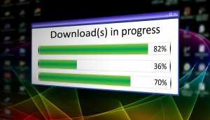 Downloads in progress on screen.