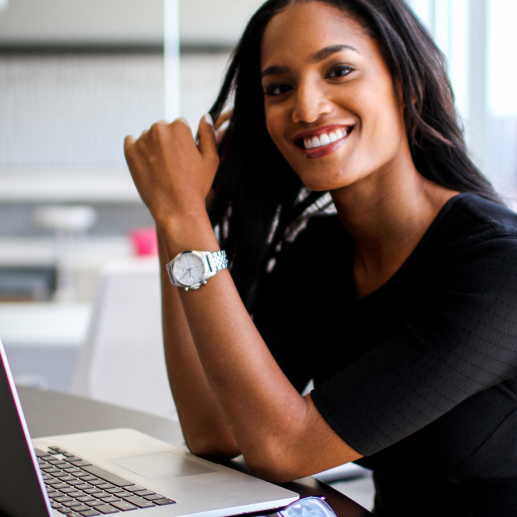 Woman of color on her laptop.