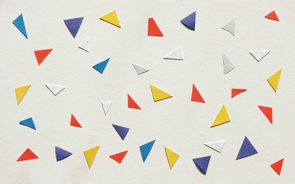 Multi-colored triangle shapes arranged on a light background.