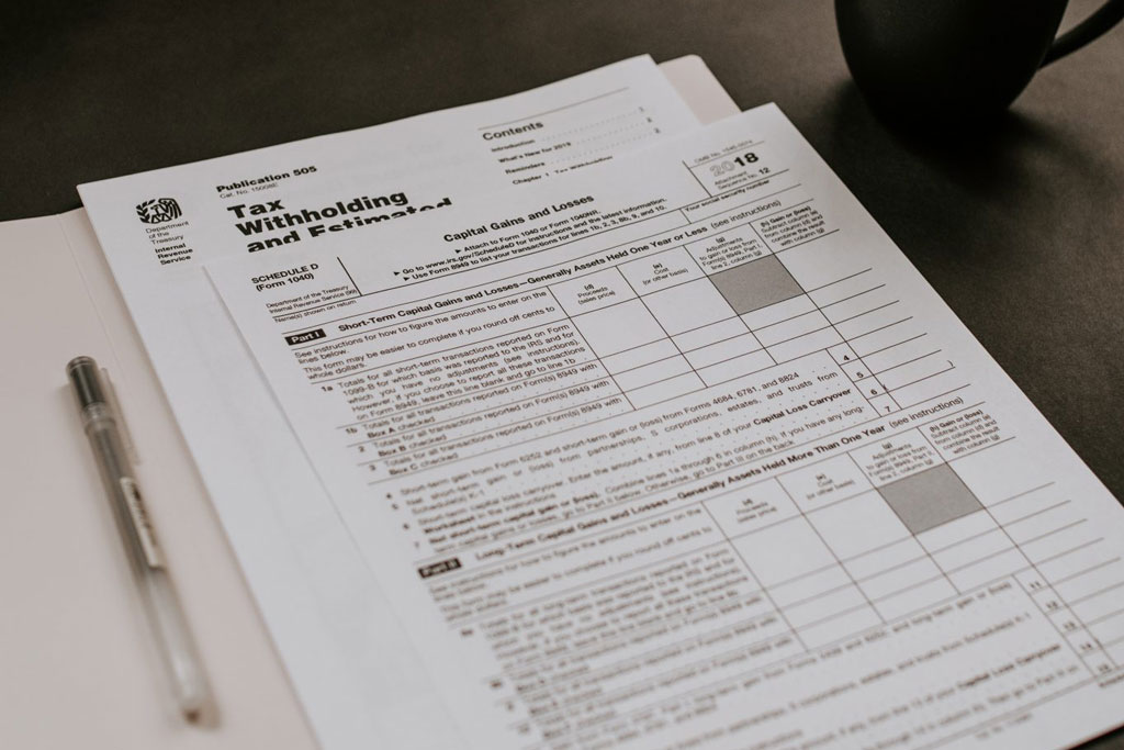 Tax forms on a desk.