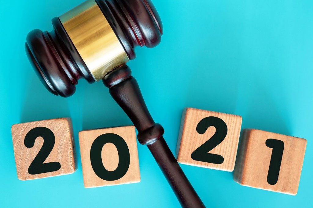 A gavel with number 2021 on wooden blocks.