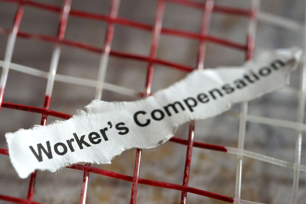 Worker's Compensation written on a piece of paper.